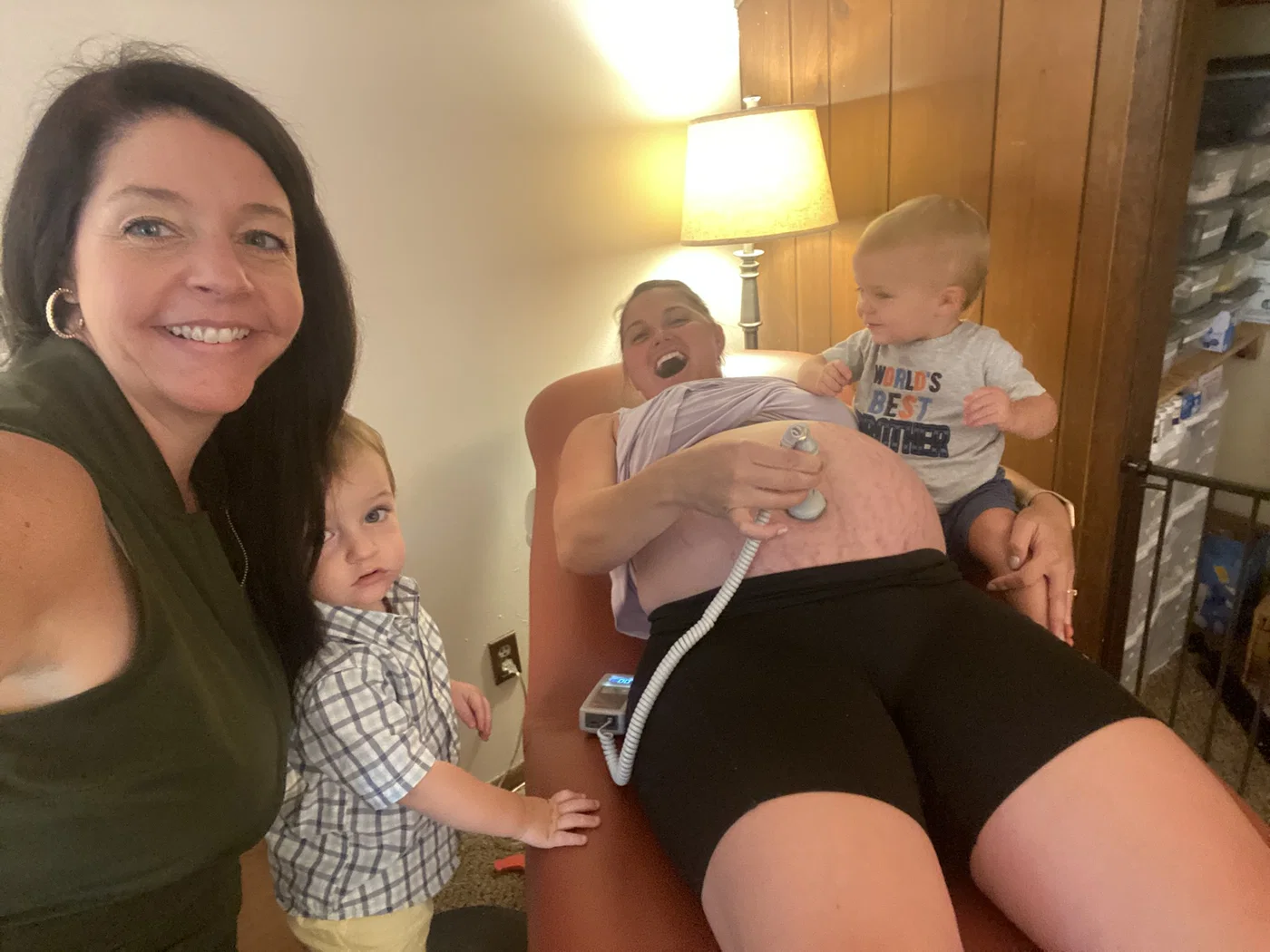A family participating in a personalized prenatal visit at home